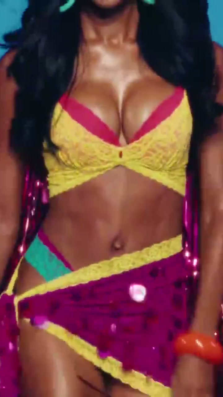 Jasmine Tookes a yellow-and-magenta look with magenta fringe wings